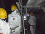 Chairman Allison Macfarlane and other NRC officials stand in the darkened interior of Reactor 4 at the Fukushima Dai-ichi nuclear complex northeast of Tokyo Dec. 13, 2012. Photo courtesy of TEPCO