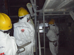 Chairman Allison Macfarlane and other NRC officials stand in the darkened interior of Reactor 4 at the Fukushima Dai-ichi nuclear complex northeast of Tokyo Dec. 13, 2012. Photo courtesy of TEPCO