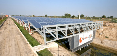 Solar PVs over a canal in India. SunEdison image