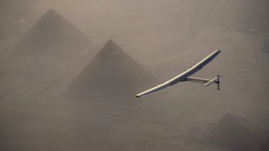 Solar Impulse 2 flies over the pyramids of Giza.