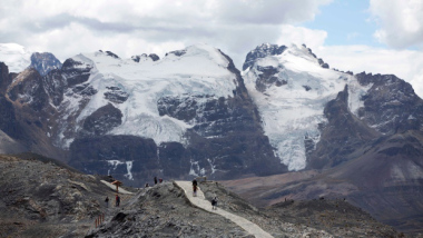 Tourists walk near the Tuco glacier in Peru. (AP / Martin Mejia)