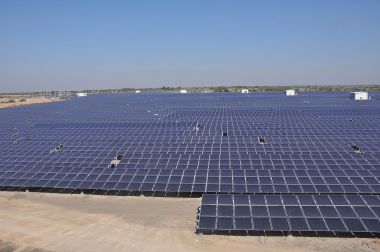An 11.5-MW solar array in India. Photo by Citizenmj. CC BY-SA 3.0. Wikimedia Commons.