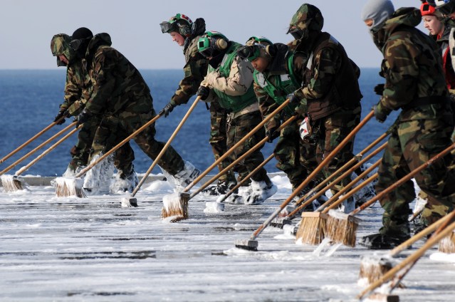 US_Navy_110323-N-IC111-436_Sailors_scrub_the_flight_deck_aboard_the_aircraft_carrier_USS_Ronald_Reagan_(CVN_76)_following_a_countermeasure_wash_dow.jpg