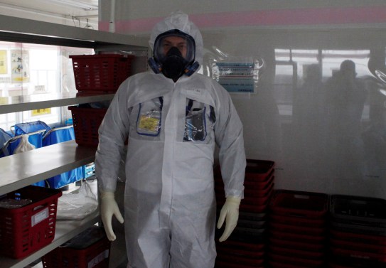 Reuters journalist Aaron Sheldrick wearing a protective suit, visits the Tokyo Electric Power Co's (TEPCO) tsunami-crippled Fukushima Daiichi nuclear power plant in Okuma town